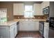 Bright kitchen with white cabinets, stainless steel appliances, and a window offering natural light at , Plainfield, IN 46168