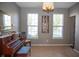 Bright living room featuring a piano, carpeted floors, and windows for natural light at , Plainfield, IN 46168