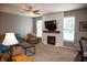 Comfortable living room with plush seating, a cozy fireplace, and plenty of natural light at , Plainfield, IN 46168