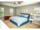 Spacious main bedroom with tray ceiling, a large bed, and ample natural light from large windows at , Plainfield, IN 46168