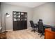 Cozy office space with neutral carpet, a dark desk, a bookcase, and a comfortable workspace at , Plainfield, IN 46168