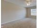 An empty bedroom with light colored carpet, window with blinds, and a ceiling fan with lights at 2234 Burgundy Way, Plainfield, IN 46168