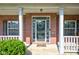 A welcoming entryway features a decorative front door and well-kept landscaping at 2234 Burgundy Way, Plainfield, IN 46168