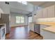 Well-lit kitchen with white cabinets, stainless steel appliances, and open view to the living space at 2234 Burgundy Way, Plainfield, IN 46168