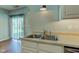 Double basin sink with stainless steel faucet on countertop in neutral-toned kitchen with natural light at 2234 Burgundy Way, Plainfield, IN 46168