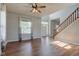 Bright living room with hardwood floors, a staircase, and natural light at 2234 Burgundy Way, Plainfield, IN 46168