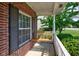 Charming front porch with a cozy swing, perfect for enjoying peaceful moments outdoors at 2234 Burgundy Way, Plainfield, IN 46168