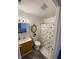 Bathroom featuring a fish-themed shower curtain and gold trimmed mirror at 2608 S Rybolt Ave, Indianapolis, IN 46241