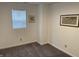 Bedroom featuring neutral walls, plush carpet, and a bright window for natural light at 2608 S Rybolt Ave, Indianapolis, IN 46241
