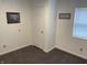 Bedroom featuring neutral walls, plush carpet, and a bright window for natural light at 2608 S Rybolt Ave, Indianapolis, IN 46241