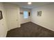 Bedroom with neutral walls, gray carpet and a window at 2608 S Rybolt Ave, Indianapolis, IN 46241