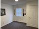 Bedroom featuring neutral walls, gray carpeting, and nautical themed decor at 2608 S Rybolt Ave, Indianapolis, IN 46241