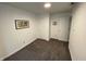 Bedroom featuring neutral walls, gray carpeting, and two doors at 2608 S Rybolt Ave, Indianapolis, IN 46241