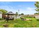 Large backyard featuring a gazebo, above ground pool, and a swing set at 2704 13Th St, Columbus, IN 47201