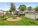 Large backyard with a fire pit, swing set, above ground pool, and gazebo at 2704 13Th St, Columbus, IN 47201