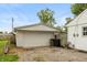 Detached garage with white door and siding, and space for parking at 2704 13Th St, Columbus, IN 47201