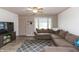 Welcoming living room with a cozy sectional couch, ceiling fan, and a view of the outdoors at 2704 13Th St, Columbus, IN 47201