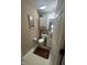 Efficient half-bath includes a vanity with granite countertop and wood-look flooring at 2916 Wind Chime Cir, Greenwood, IN 46143