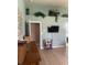 Bedroom featuring built-in shelving up high, flat screen tv and ensuite bathroom entrance at 2916 Wind Chime Cir, Greenwood, IN 46143
