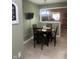 Cozy dining area features a round table with four chairs and a view to the next room at 2916 Wind Chime Cir, Greenwood, IN 46143