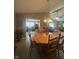 Warm dining room features a classic wooden table and chairs, open to the living area for easy flow at 2916 Wind Chime Cir, Greenwood, IN 46143