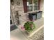 Inviting front porch with seating and decorative plants, offering a warm welcome at 2916 Wind Chime Cir, Greenwood, IN 46143