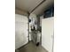 Garage space featuring a garage door, storage area, and utility items at 2916 Wind Chime Cir, Greenwood, IN 46143