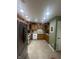 Well-lit kitchen featuring warm wood cabinets, tile flooring, and modern white appliances at 2916 Wind Chime Cir, Greenwood, IN 46143
