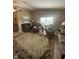 Comfortable living room showcasing a large rug, several upholstered chairs, and natural light at 2916 Wind Chime Cir, Greenwood, IN 46143