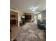 Spacious living room featuring a patterned rug, large TV, and comfortable seating, ideal for relaxation and entertainment at 2916 Wind Chime Cir, Greenwood, IN 46143