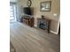 Inviting living room features wood flooring, an entertainment center, and an electric fireplace, creating a cozy ambiance at 2916 Wind Chime Cir, Greenwood, IN 46143