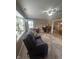 Inviting living room with a cozy recliner, a bright window, and a glimpse of the dining area at 2916 Wind Chime Cir, Greenwood, IN 46143