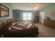 Spacious main bedroom showcasing a quilt bed, light walls and two wooden chests of drawers at 2916 Wind Chime Cir, Greenwood, IN 46143