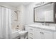 Bathroom featuring a shower-tub combo with a subway tile surround and a marble vanity at 2947 Talping Row, Indianapolis, IN 46268