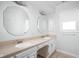 Bright bathroom featuring double sinks, octagon mirrors, and ample counter space at 2947 Talping Row, Indianapolis, IN 46268