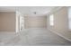 Bright, open bedroom with plush carpeting, neutral walls, and classic crown molding detail at 2947 Talping Row, Indianapolis, IN 46268