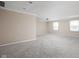 Spacious bedroom with neutral carpet, crown molding, and two windows for natural light at 2947 Talping Row, Indianapolis, IN 46268
