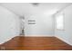 Bedroom featuring hardwood floors and a modern chandelier at 2947 Talping Row, Indianapolis, IN 46268