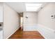 Dining room featuring a skylight, wainscoting, and hardwood floors at 2947 Talping Row, Indianapolis, IN 46268