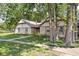 Charming home with stone accents, an American flag, and a well-manicured lawn at 2947 Talping Row, Indianapolis, IN 46268