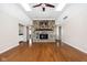 Spacious living room with hardwood floors, a stone fireplace and ample natural light at 2947 Talping Row, Indianapolis, IN 46268