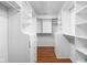 Spacious walk-in closet with built-in shelving, drawers, and ample storage space at 2947 Talping Row, Indianapolis, IN 46268