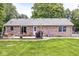 Brick home with a large yard, outdoor patio and ample space for entertaining at 312 W Clark Ln, Fairland, IN 46126
