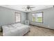 Bedroom featuring carpet, two windows, and a crib at 312 W Clark Ln, Fairland, IN 46126