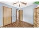 Bedroom featuring hardwood floors, multiple closets, and lots of light at 312 W Clark Ln, Fairland, IN 46126
