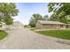 Charming brick home with a gravel driveway and a large outbuilding, perfect for a workshop or storage at 312 W Clark Ln, Fairland, IN 46126