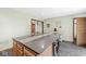 Open kitchen with a large island, plenty of storage, and a view into the adjacent rooms of the home at 312 W Clark Ln, Fairland, IN 46126