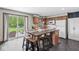 Bright kitchen with a large island, wooden cabinets, and a view to the backyard through sliding glass doors at 312 W Clark Ln, Fairland, IN 46126