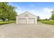 Outbuilding featuring a two-car garage with ample parking space at 312 W Clark Ln, Fairland, IN 46126