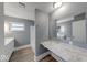 Bathroom features an extended vanity space, tub and shower at 3220 Newton Ave, Indianapolis, IN 46201